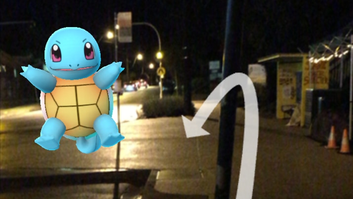 A screen capture of a Pokemon next to a bus stop at night.