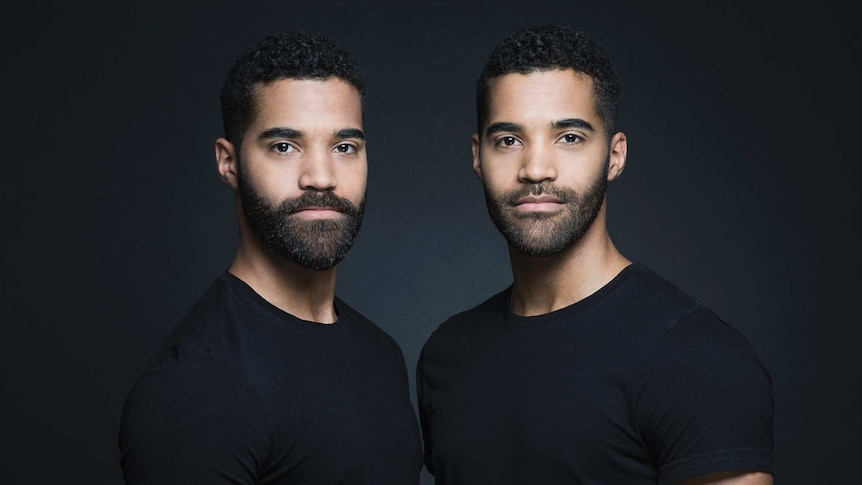 Male twins in black t-shirts
