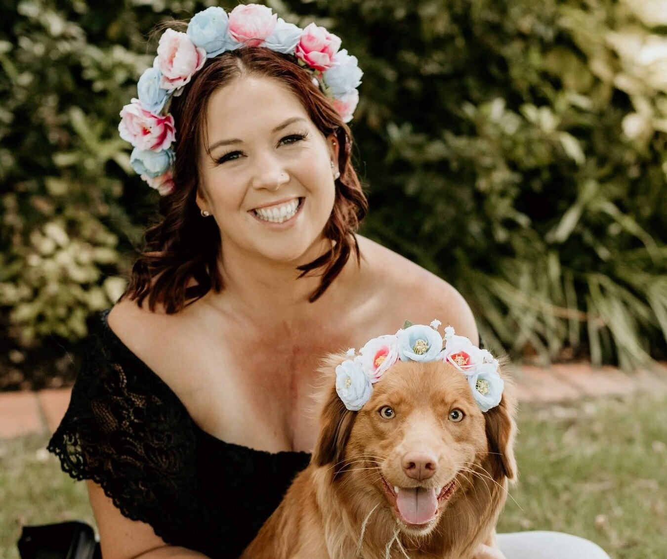 woman cuddling on Canadian duck toller dog called Taco