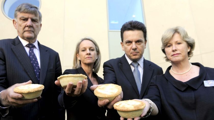 LtoR Senators Bill Heffernan,Fiona Nash, Nick Xenophon and Christine Milne hold out meat pies