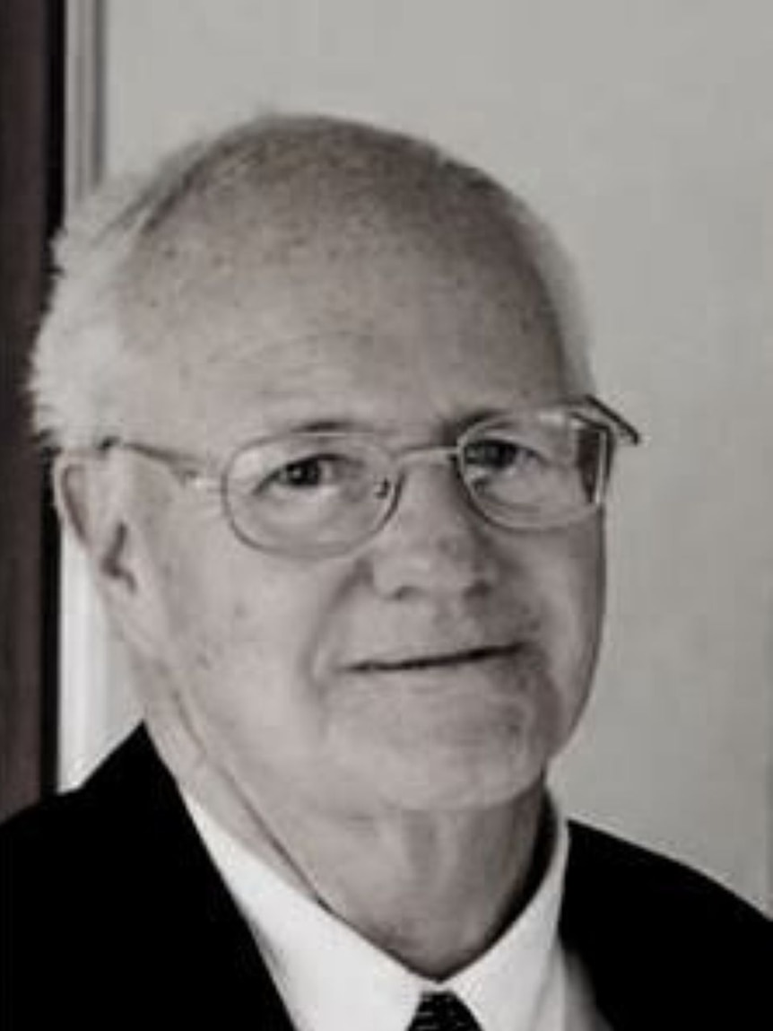 B&W Older man in black suit and glasses