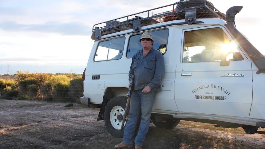 Stu McEwan stands outside his "office"