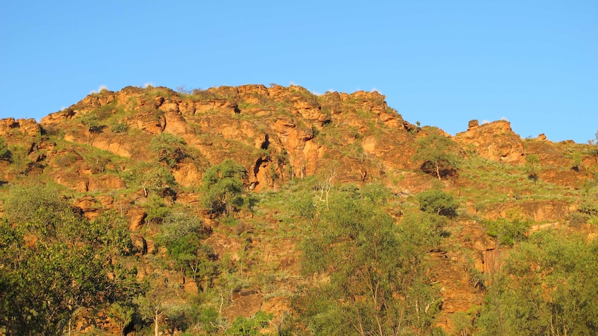 Sun sets on rocky ranges