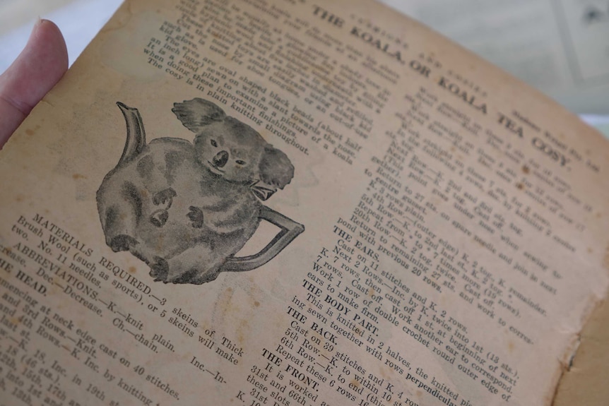 An old book with writing describing how to make a tea cosy.