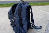 School bag on footpath in Melbourne.