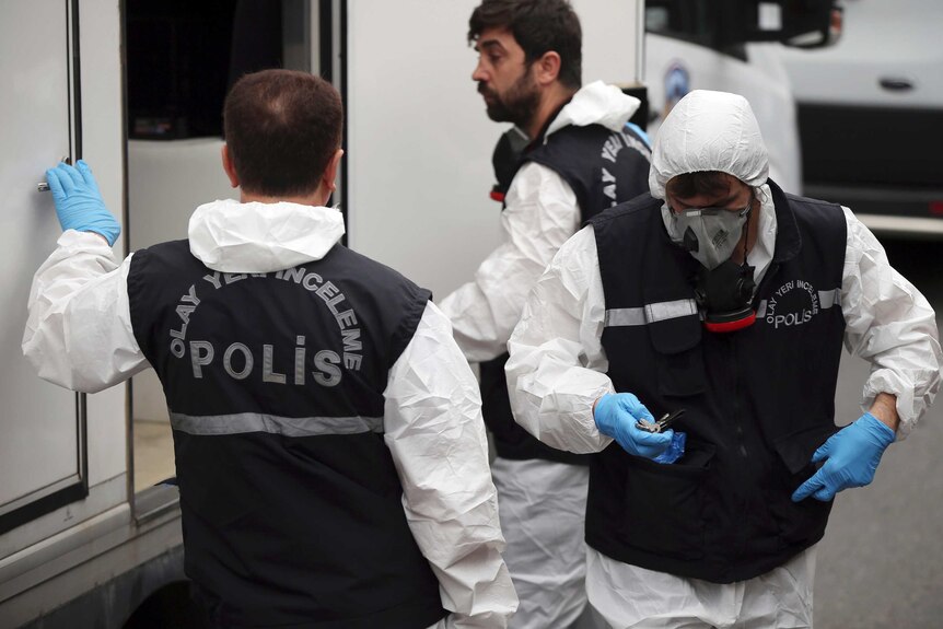 Turkish police wearing forensic investigation gear prepare to enter the residence of the Saudi consul in Istanbul.