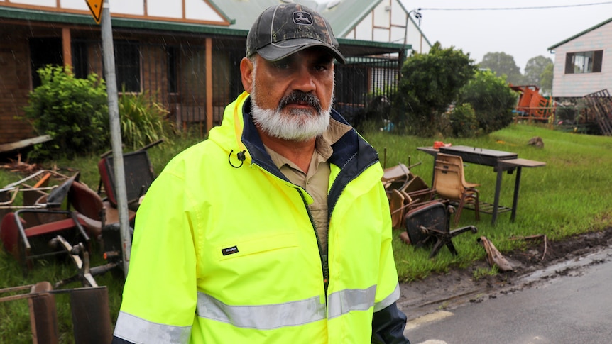 a man wearing a high viz jacket outdoors 