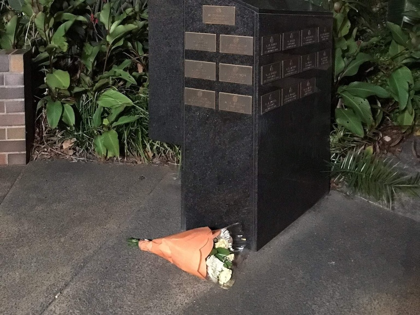 Flowers laid outside entrance to Toowoomba police station