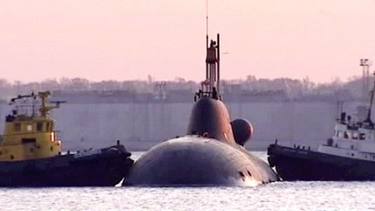 The K-152 Nerpa is manouvred at the navy base of Bolshoi Kamen