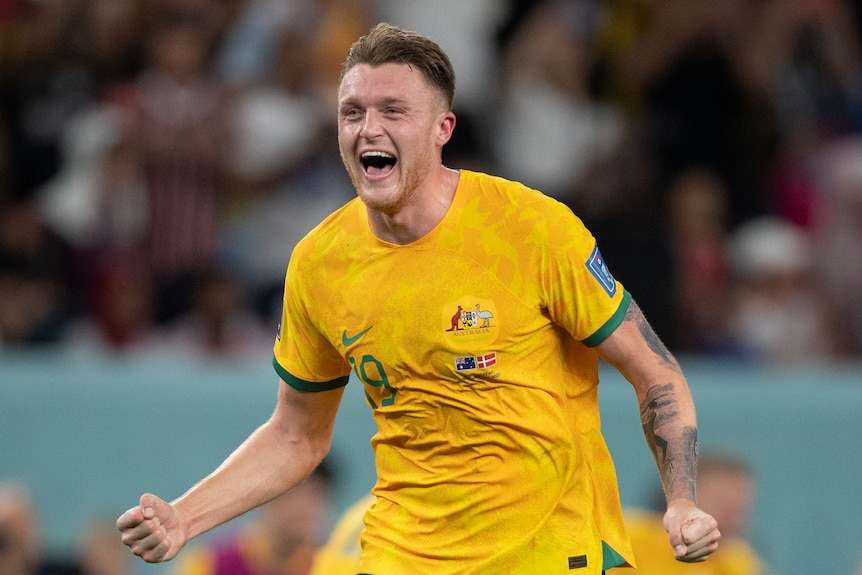 Harry Souttar celebrates after Australia play Denmark with a double first pump
