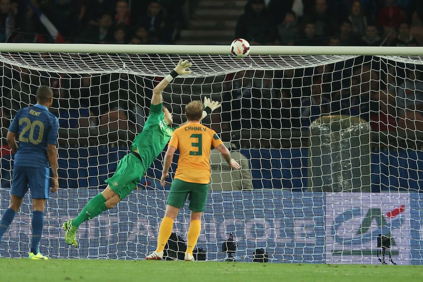 Australian keeper Mitchell Langerak is beaten by a shot from France's Olivier Giroud in Paris.