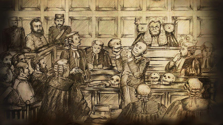 Dr Hobbs holds up the skulls of slaves inside the court
