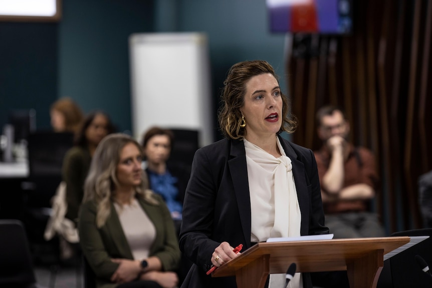 Woman speaking at the Commission of Inquiry.