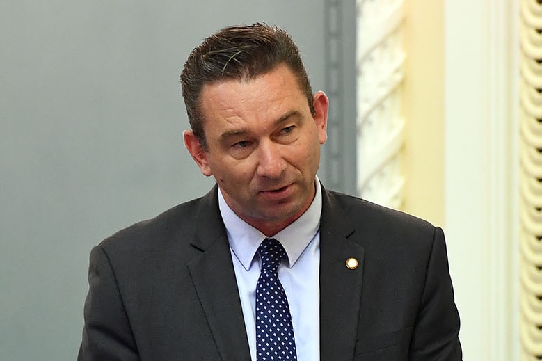Craig Crawford stands during Question Time in State Parliament in Brisbane.