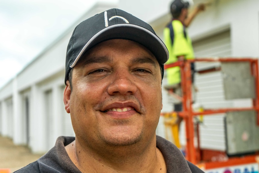 Close-up of a man in a baseball cap.