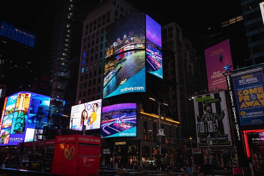 A digital billboard in NYC's Time Square with the Harbour Bridge on it