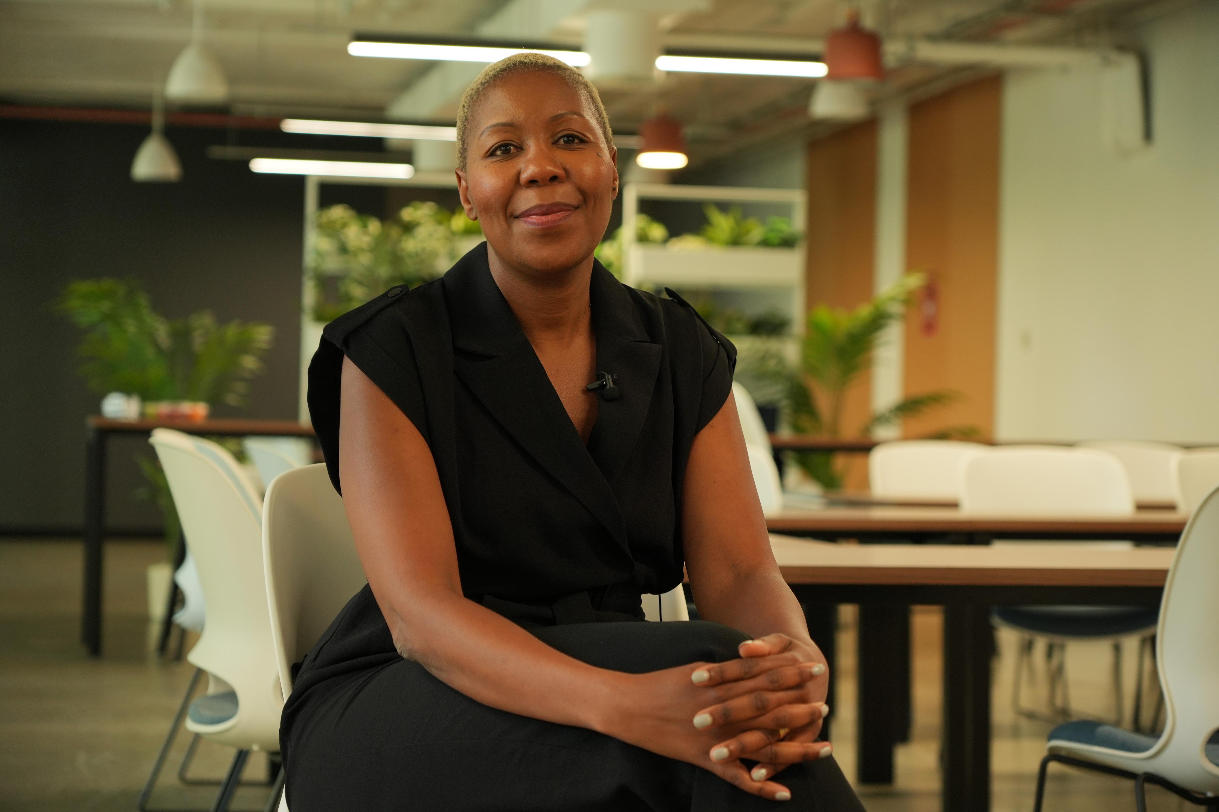 A woman named Sisonke Msimang sits and smiles.