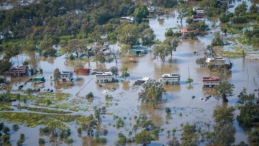 An aerial shot of a small, remote community that has been flooded.