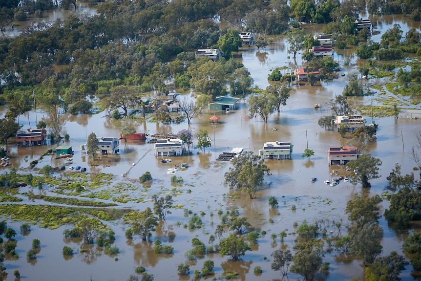 An aerial shot of a small, remote community that has been flooded.
