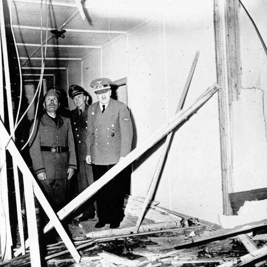 Adolf Hitler and Benito Mussolini inspect Hitler's bombed out HQ after an assassination attempt on Hitler in 1944