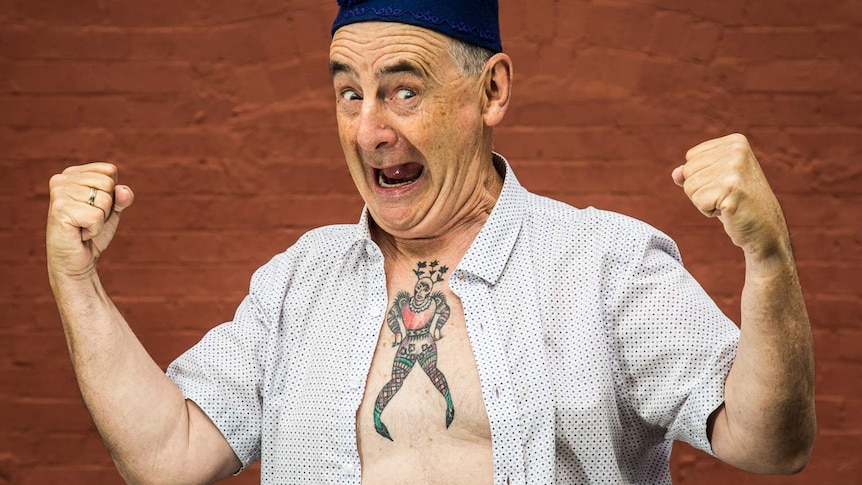 Man showing tattoo on chest
