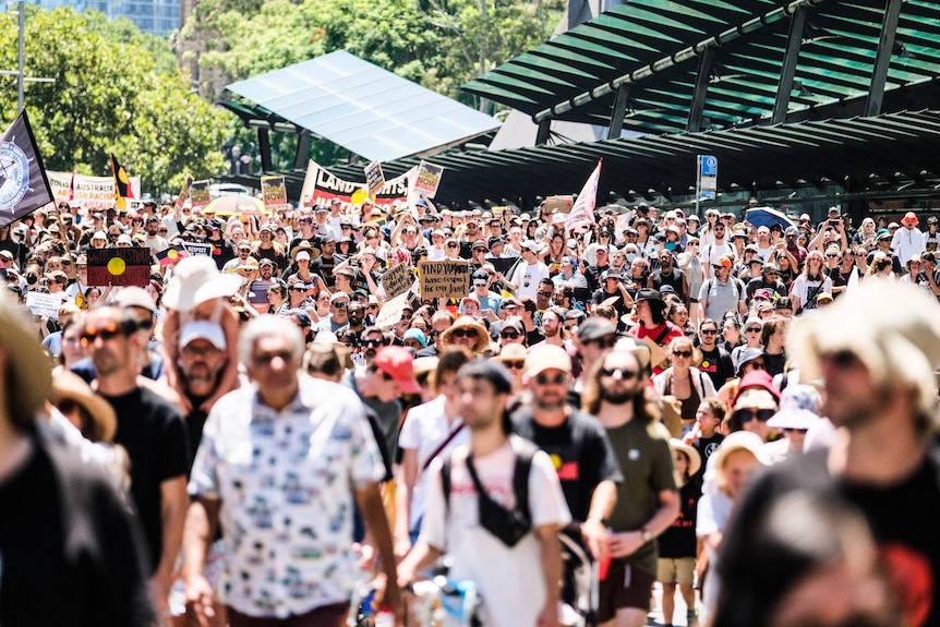 A large crowd march through Sydney