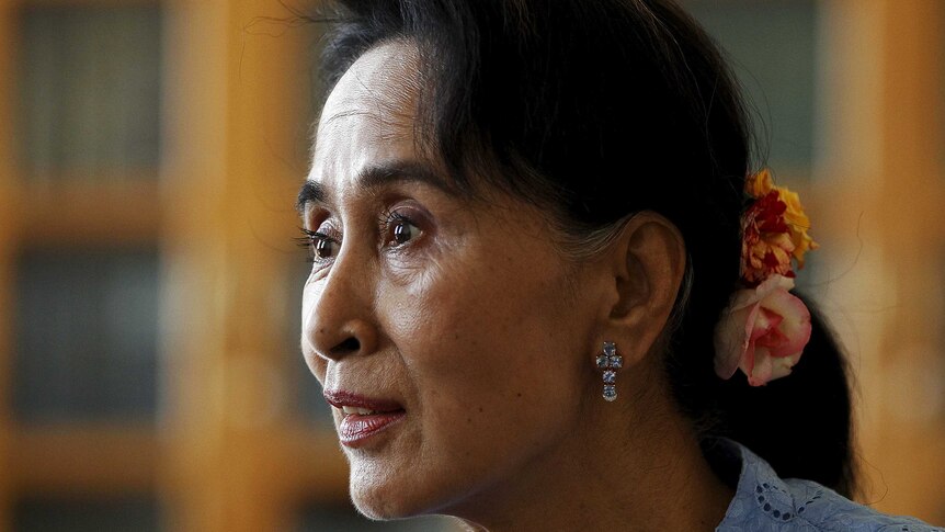 Aung San Suu Kyi speaks to reporters in her Myanmar office on April 3, 2015