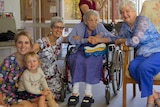 Five generations of women pose for photo
