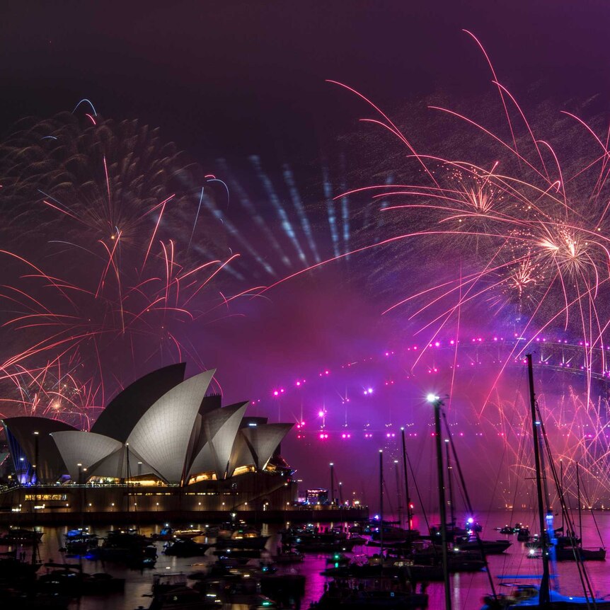 Fireworks lighting up the sky around the Sydney Harbour Bridge.