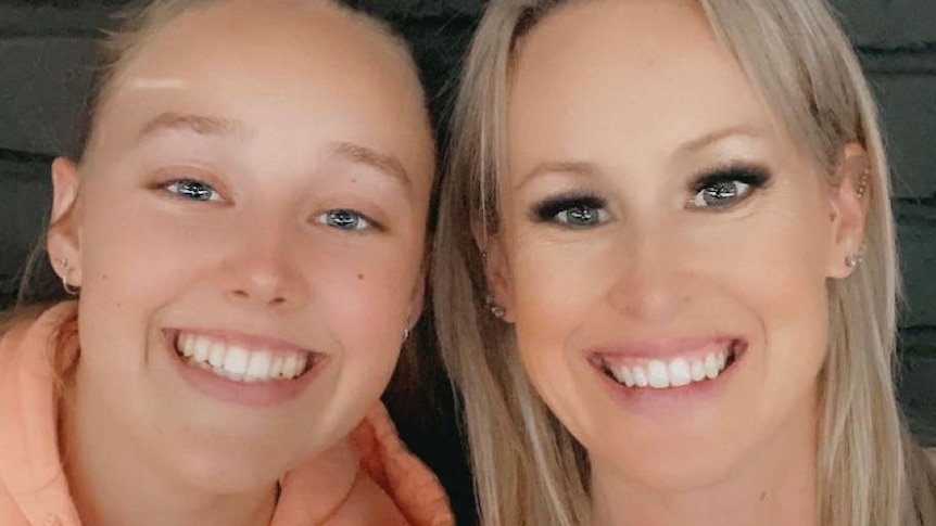 Two young women smiling in a selfie photo.