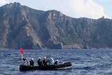 Japanese coast guards sail past one of the disputed Senkaku islands, or Diaoyu as they are known in China.
