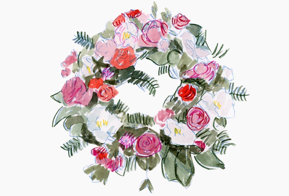 A wreath of colourful flowers of pink, red and white.