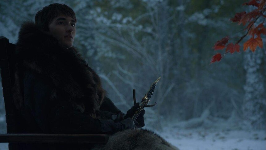 Bran holds the catspaw dagger while sitting in his wheelchair.