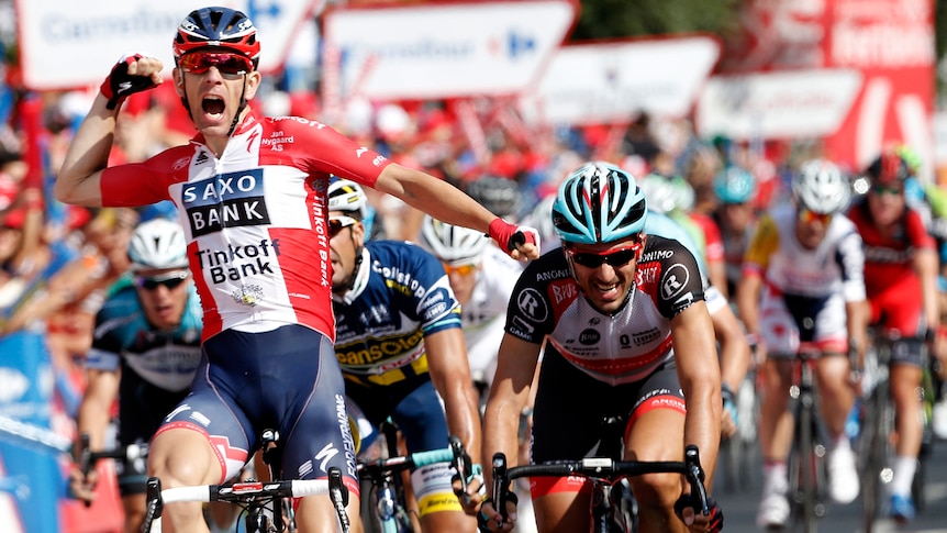 Danish rider Michael Morkov (L) celebrates his win in stage six of the Tour of Spain.