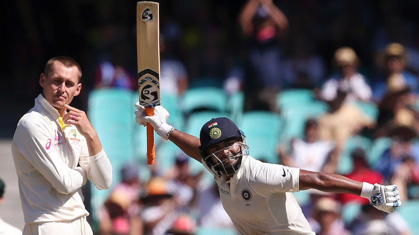 India batsman Rishabh Pant swings his bat in glee during a Test at the SCG. Marnus Labuschagne can't look. He turns away.