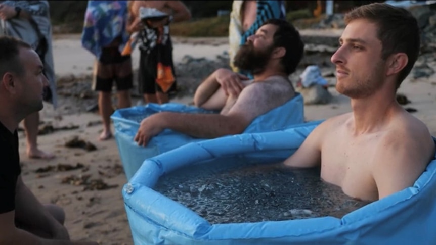 a few men soaking in ice baths at Shelly Beach in Port Macquarie