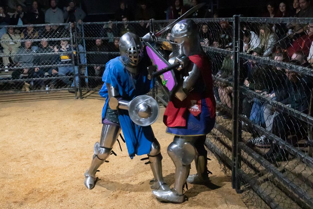 Two knights fighting in costumes