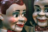 A close-up of two ventriloquist clowns