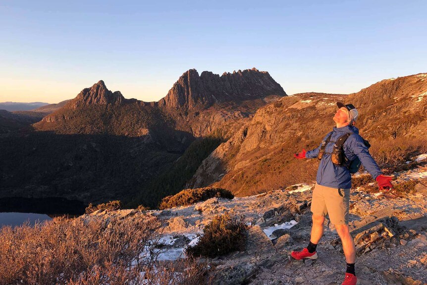 Lincoln Quilliam enjoys the sunrise at Cradle Mountain