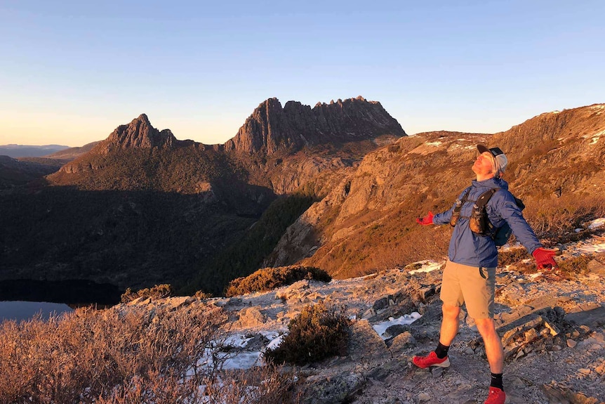 Lincoln Quilliam enjoys the sunrise at Cradle Mountain
