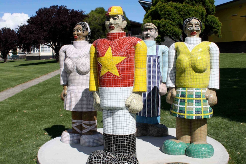 A sculpture of four colourful figures, including a jockey and a butcher.