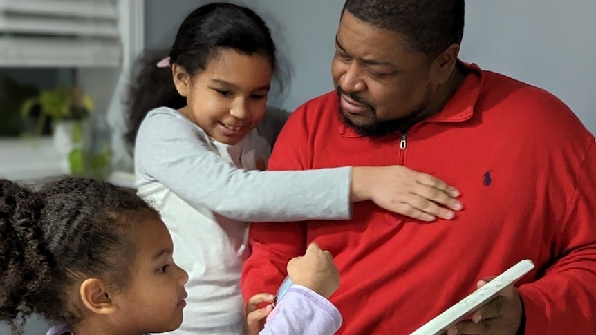 Robert Williams with his daughters