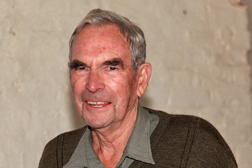 Close-up portrait of an elderly man.