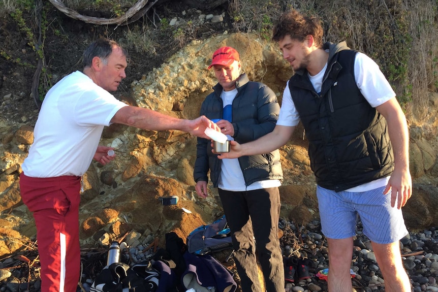 ABC newsreader Peter Gee with other cold swim enthusiasts, Hobart.