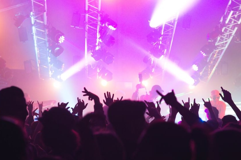 Schoolies partying outside in front of the event's main stage