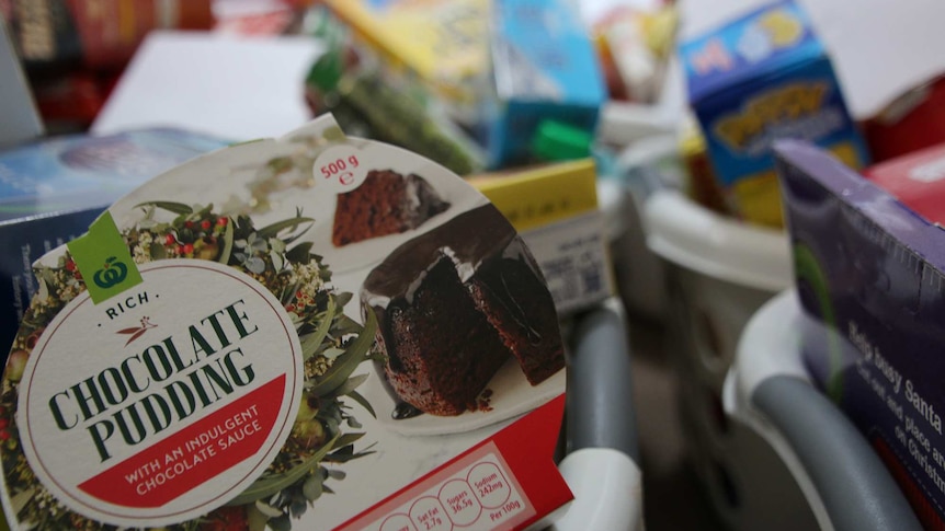 A close-up shot of a chocolate pudding in a charity hamper.