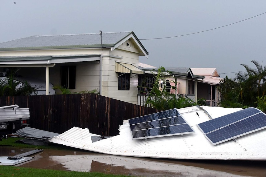 A roof equipped with solar panels was ripped from a house in Bowen, most of the town has found itself largely intact.