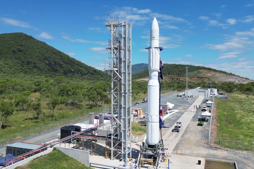 Video shows a large rocket being rolled onto a launch pad horizontally and then stood up