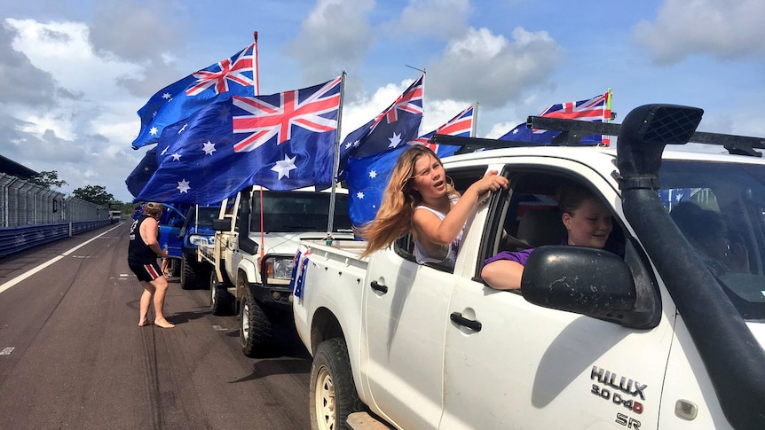A group of utes participate in the annual Variety ute run in Darwin
