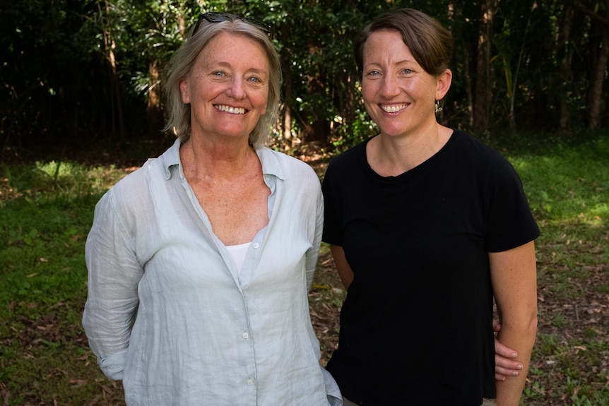 Photo of two women smiling at the camera.